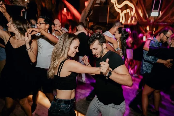 Dancers enjoying a crowded social dance night